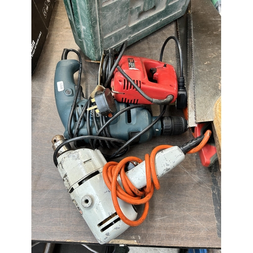 979 - A collection of tools to include Black & Decker 240v hammer drill, Power Devil 240v jigsaw etc.