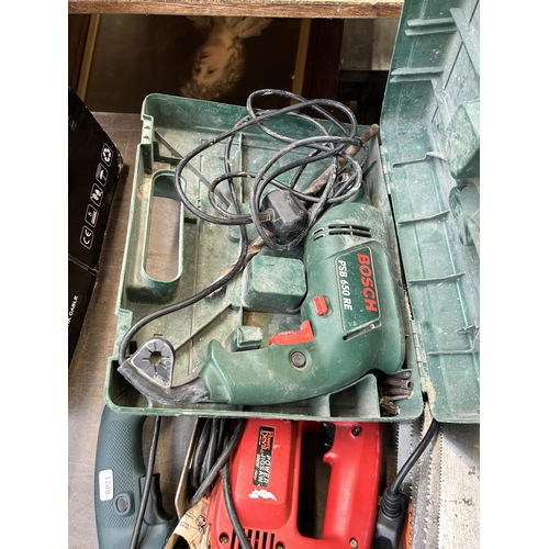 979 - A collection of tools to include Black & Decker 240v hammer drill, Power Devil 240v jigsaw etc.