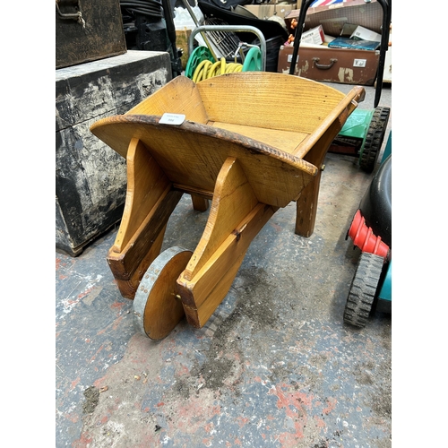 986 - An oak wheel barrow planter