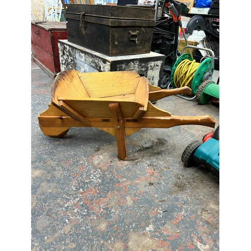 986 - An oak wheel barrow planter