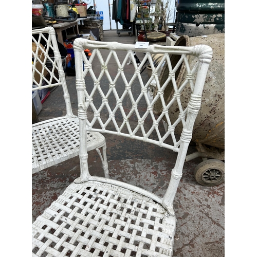 990 - A pair of cast metal and white painted garden chairs