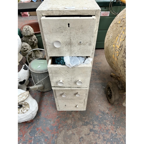 992 - A white painted hard wood four drawer cabinet with contents together with beer barrel converted plan... 