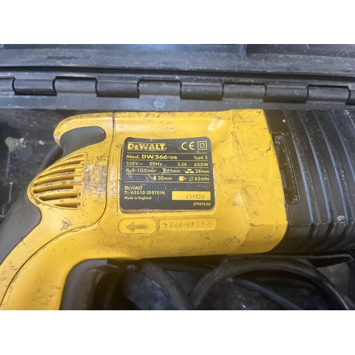 900 - A cased DeWalt DW566-GB 240v hammer drill