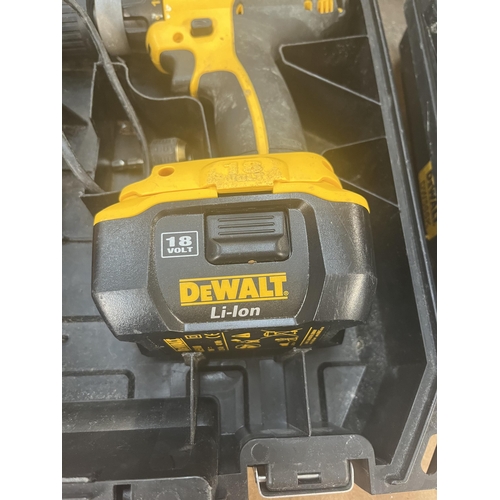 902 - A cased DeWalt DC727 18v cordless lithium ion drill with two batteries and charger