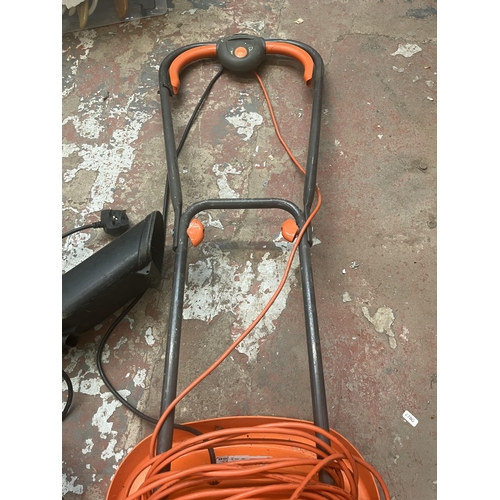 905 - Two 240v items, one Worx leaf blower and one Flymo lawnmower