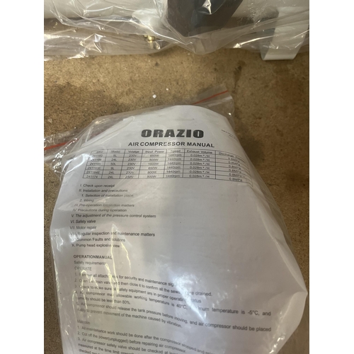 909 - An Orazio 240v air compressor with manual