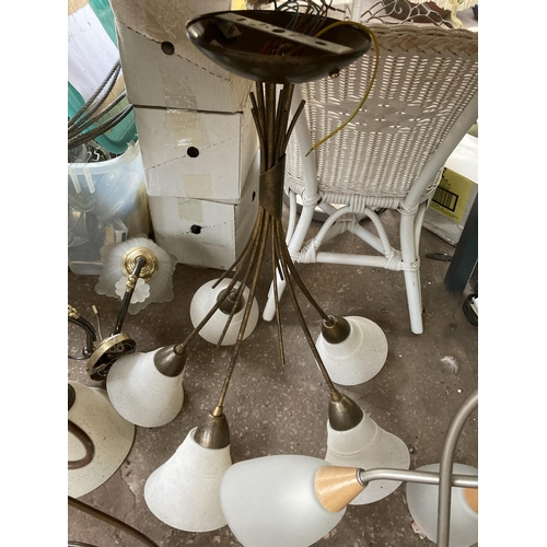 1045 - A collection of lighting to include Tiffany style table lamp, wall sconces, pair of three branch cei... 