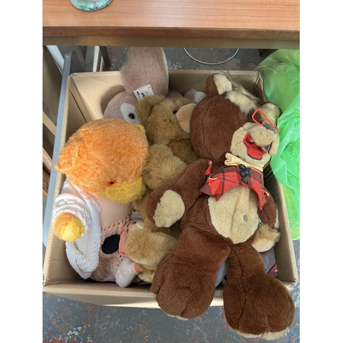 1086 - Three boxes and two bags containing a large collection of soft toys and dolls to include Galoob bear... 