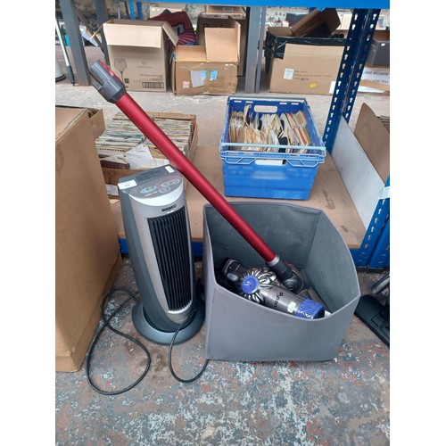 813 - Two items, one Dyson SV05 handheld cordless bagless vacuum cleaner with attachments and charger and ... 