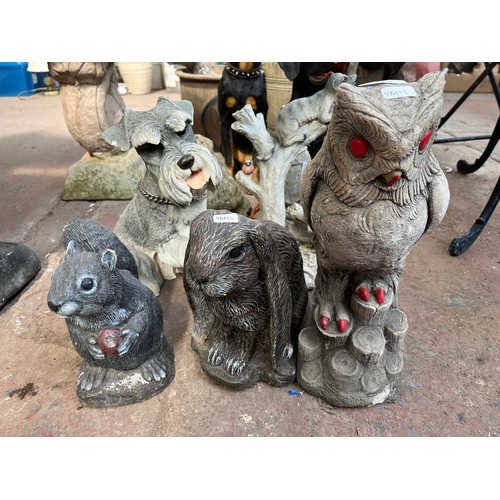 998 - Nine cast stone and fibreglass animal garden ornaments