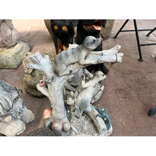 998 - Nine cast stone and fibreglass animal garden ornaments