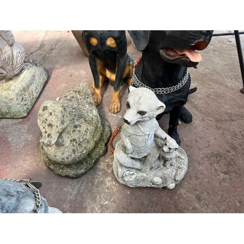 998 - Nine cast stone and fibreglass animal garden ornaments