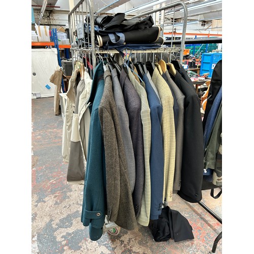 543A - A large quantity of men's clothing to include Barbour sweatshirt, Gannex country jacket, 100% cashme... 