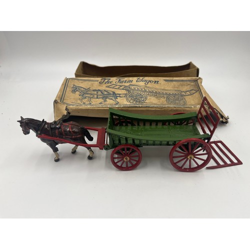 534 - A collection of boxed Britains hand painted lead horse and carriage figures together with a Charbens... 