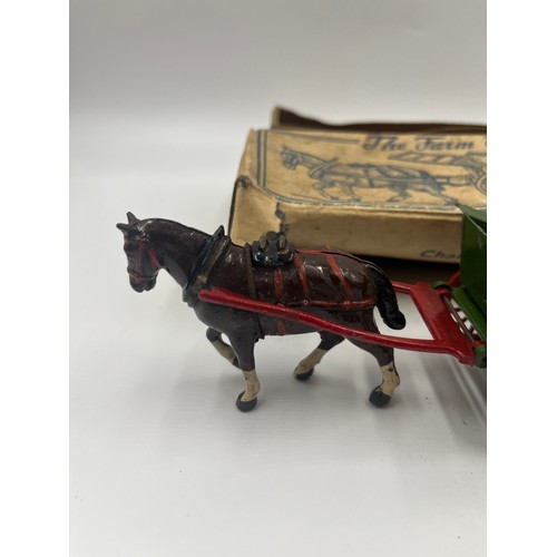 534 - A collection of boxed Britains hand painted lead horse and carriage figures together with a Charbens... 