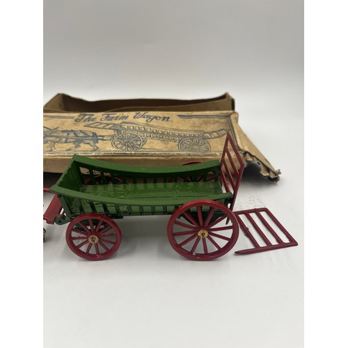 534 - A collection of boxed Britains hand painted lead horse and carriage figures together with a Charbens... 