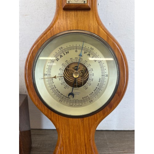 634 - Two items, one oak cased quartz mantel clock and one J. D. Siddall wooden cased barometer