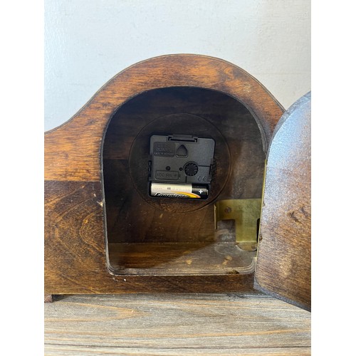 634 - Two items, one oak cased quartz mantel clock and one J. D. Siddall wooden cased barometer