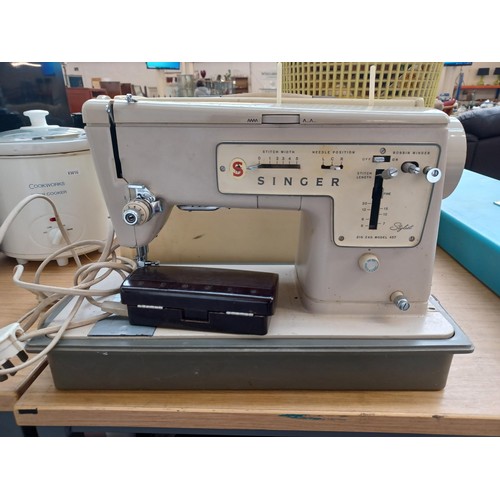 789 - A cased Singer Zig Zag model 457 electric sewing machine with foot pedal