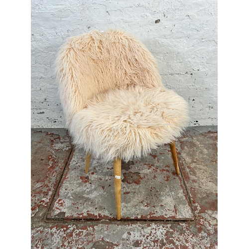 57 - A faux fur side chair with beech splayed supports