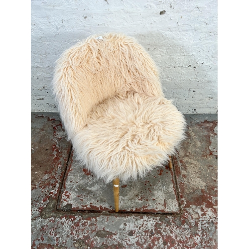 57 - A faux fur side chair with beech splayed supports