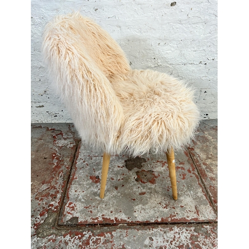 57 - A faux fur side chair with beech splayed supports