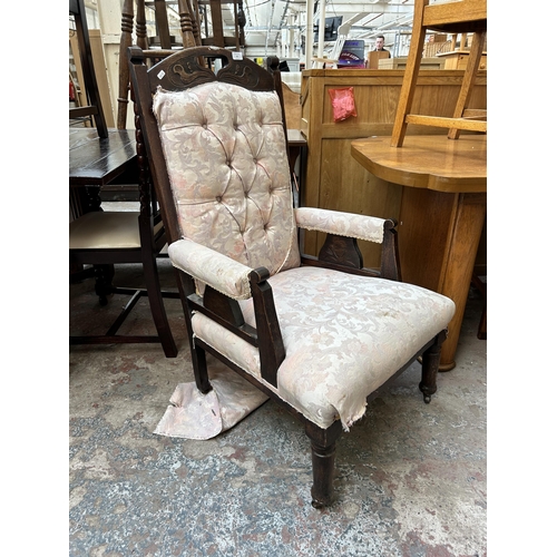 72 - An Edwardian carved oak and fabric upholstered armchair