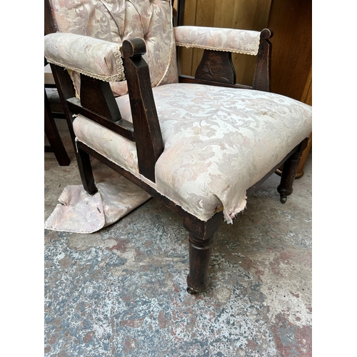 72 - An Edwardian carved oak and fabric upholstered armchair