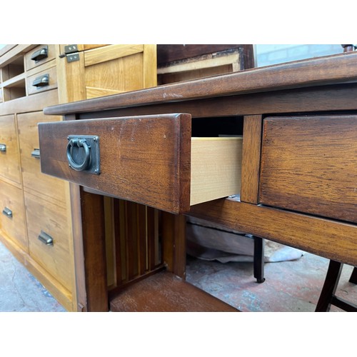 97 - An Arts & Crafts style oak two drawer console table - approx. 72cm high x 127cm wide x 46cm deep