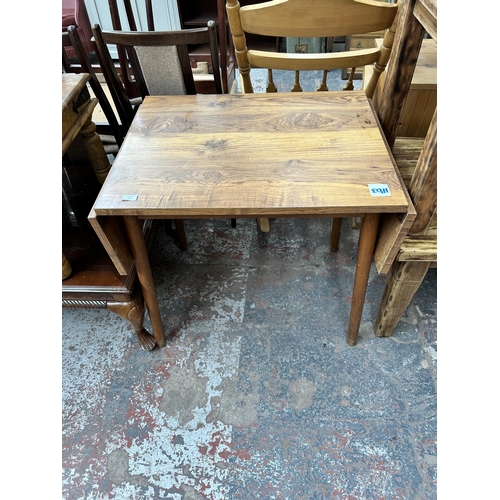 128 - A teak effect and beech drop leaf kitchen table