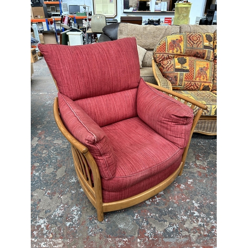 207 - An Ercol Renaissance elm and red fabric armchair