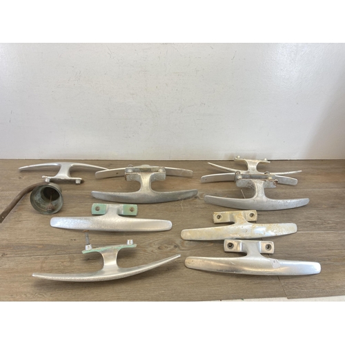 357 - Ten mid 20th century Dryad aluminium door handles together with a brass wall hanging bell