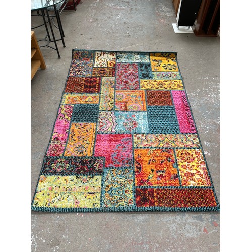 48 - A Happiness multi coloured rug - approx. 200cm x 140cm