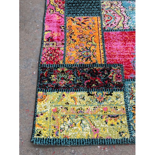 48 - A Happiness multi coloured rug - approx. 200cm x 140cm