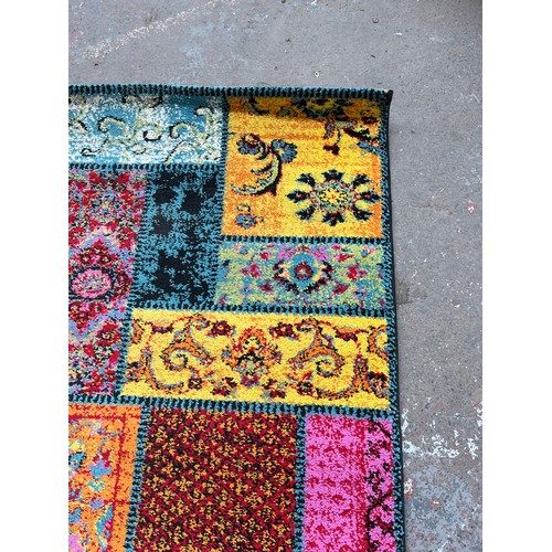 48 - A Happiness multi coloured rug - approx. 200cm x 140cm