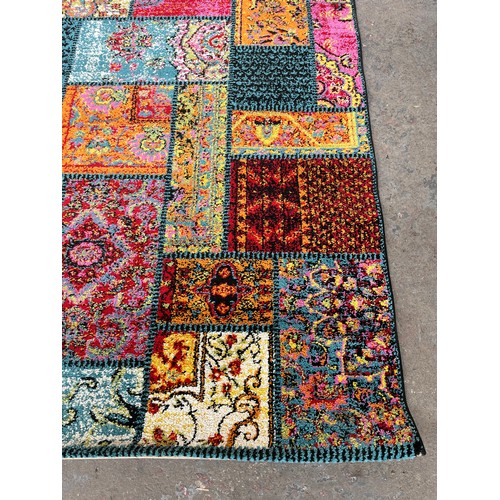 48 - A Happiness multi coloured rug - approx. 200cm x 140cm