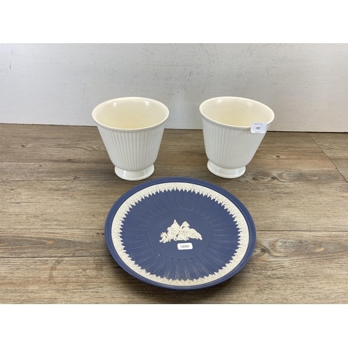 303 - Three pieces of Wedgwood pottery, pair of Moonstone jardinières and one Portland blue Jasperware pla... 