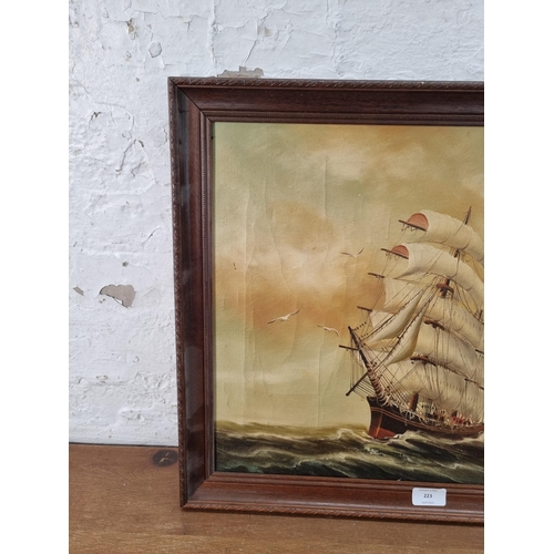 223 - A framed oil on canvas of a sailing ship signed lower right - approx. 47cm high x 57cm wide