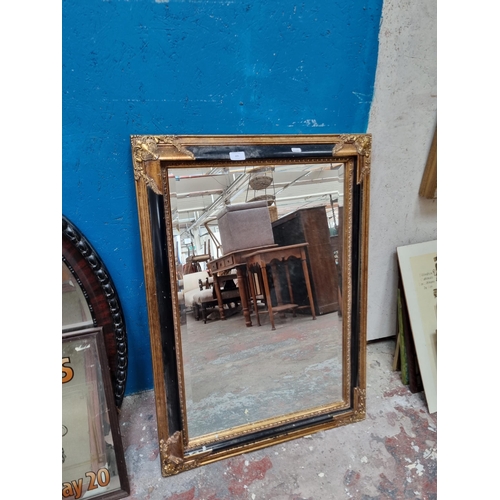 225 - Four items, one 19th century style black and gilt framed bevelled edge wall mirror, two Welsh rugby ... 