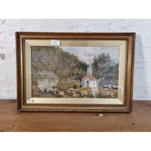 227 - A gilt framed oil painting of a church scene - approx. 34cm high x 50cm wide