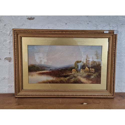 235 - A late 19th/early 20th century gilt framed oil painting of a landscape scene - approx. 41cm high x 6... 