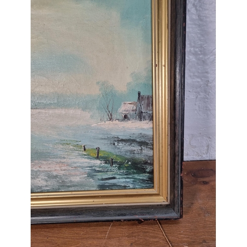 244A - A framed oil on canvas of a winter landscape scene signed Gilbert - approx. 49cm high x 59cm wide