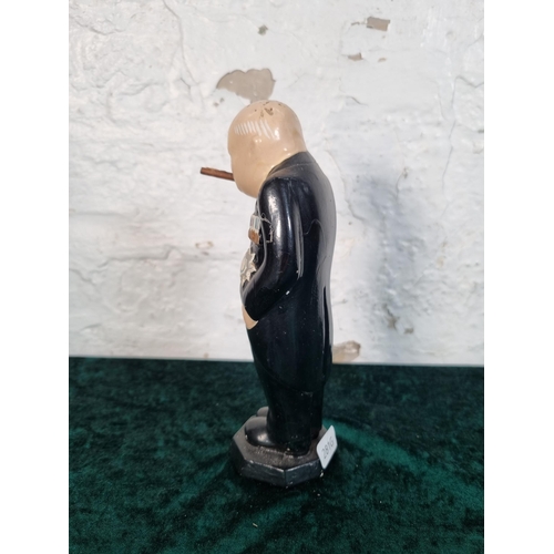 258 - A chalkware figurine of Winston Churchill - approx. 19cm high