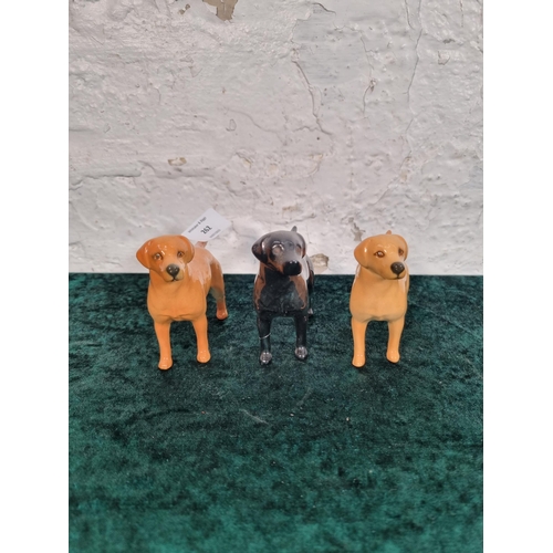 262 - Three Beswick dog figurines