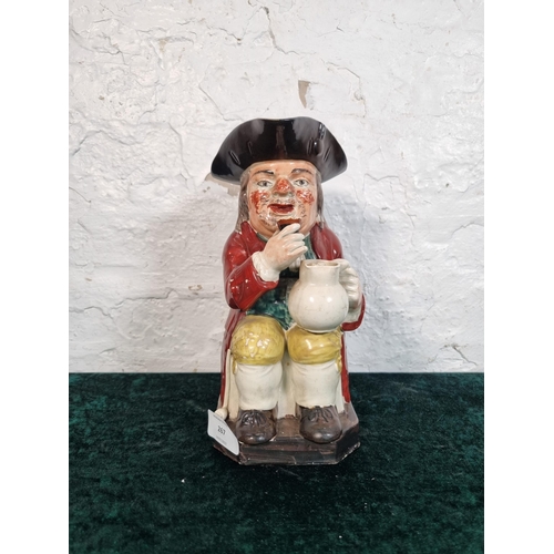 267 - A 19th century hand painted ceramic Toby jug - approx. 25cm high