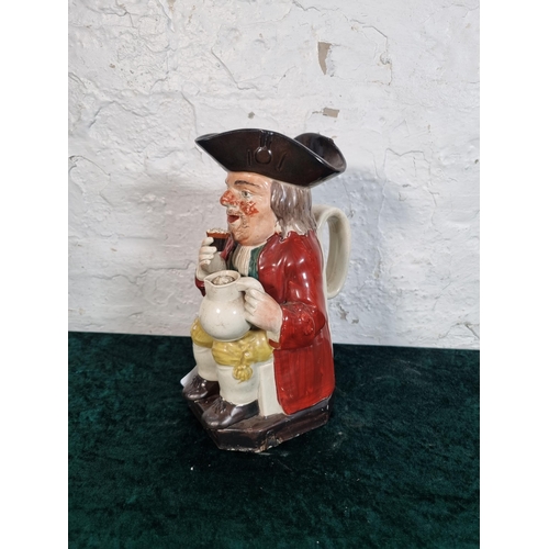 267 - A 19th century hand painted ceramic Toby jug - approx. 25cm high