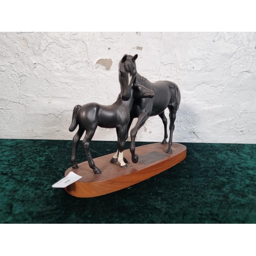 268 - A Beswick Connoisseur model of Black Beauty and Foal on mahogany plinth - approx. 20cm high