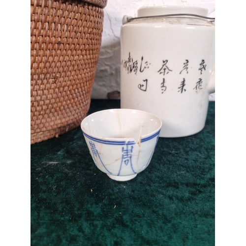 269 - A Chinese republic period porcelain teapot with cup and wicker basket