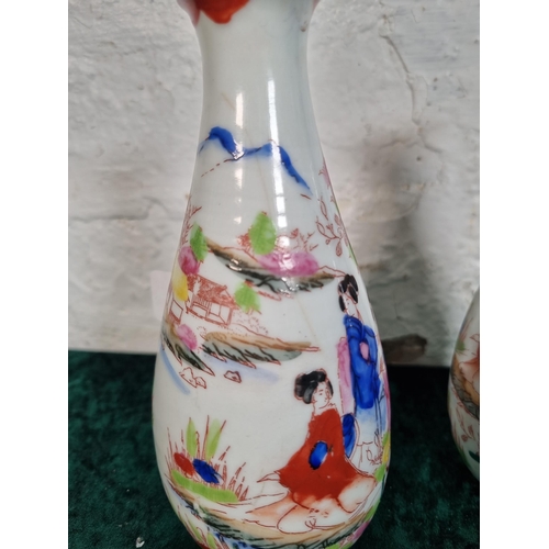 270 - A pair of Oriental hand painted porcelain vases - approx. 17cm high