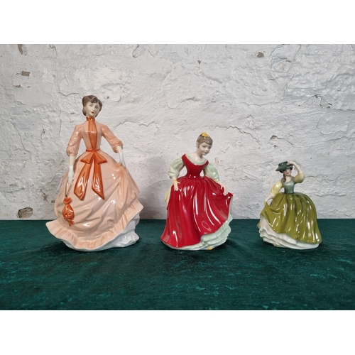 276 - Three ceramic figurines, one Royal Worcester Charity and two Royal Doulton, Fair Maiden HN 2434 and ... 